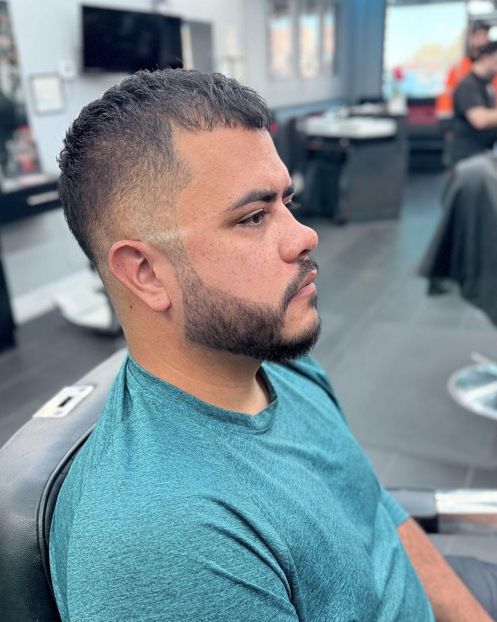 Short crop with a high skin fade and a shaped beard